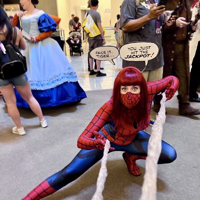 Wondful cosplay prop... saran wrap between her hands & the photographer holds the other end to make webbing.